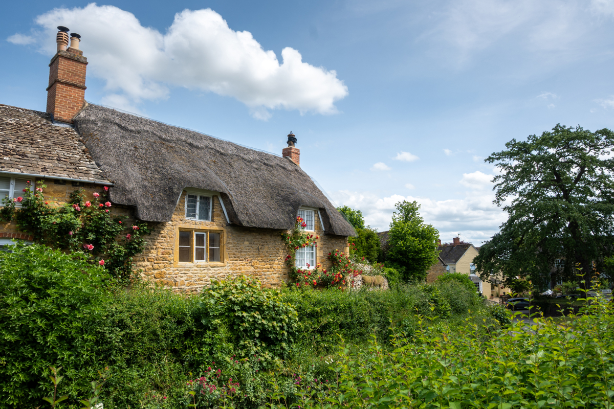 Thatched house with a garden